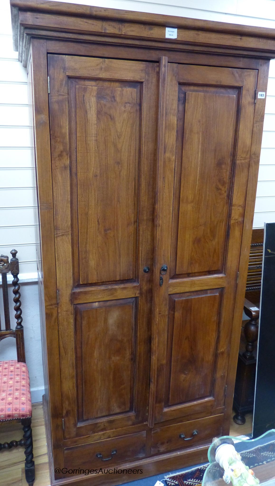 A hardwood two door cabinet, length 102cm, depth 68cm, height 201cm